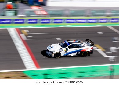 Vallelunga, Italy September 18th 2021 Aci Racing Weekend. Fast Bmw Touring Race Car On Racetrack Finish Checkered Line Motion Blurred Background