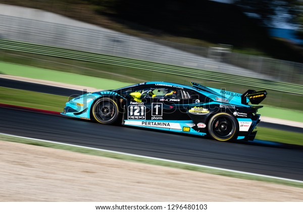 Vallelunga, Rome\
Italy november 17 2018. Lamborghini World final championship. Full\
length side view of car racing in action during the motor sport\
event race, blurred\
background