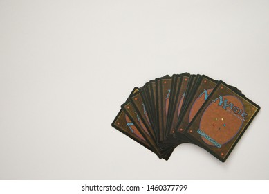 VALLETTA, MALTA - JULY 24TH, 2019: Magic: The Gathering cards on a white surface. Copy space