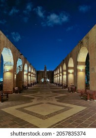 Valletta, Malta - November 10th 2020: The terraced arches at the Upper Barrakka Garden lit up at night. A public garden since 1800 it was created in 1661 for the Knights of St John.