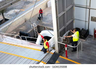 Valletta, Malta / November 2019: Ferry workers preparing the ship for departure