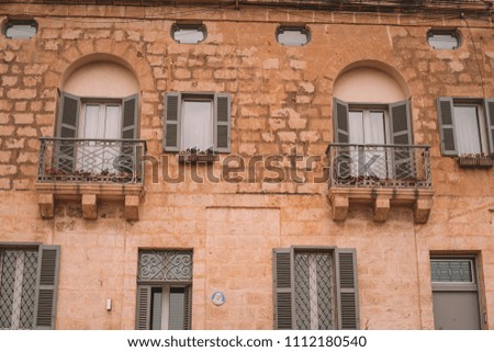 Valletta, Malta - The traditional houses, narrow streets and walls of Valletta, the capital city of Malta on an early summer morning before sunrise