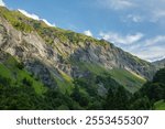 Valley in Alps scenery, Batoni Waterfalls hiking trail in Switzerland	
