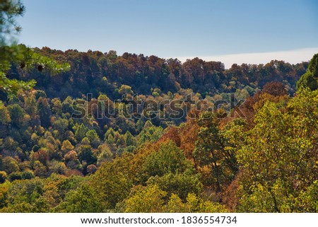 Valley during fall in buzzard roost chillicothe. Colorful trees on hillside of apalachian foothills. Orange, red, and yellow leaves on trees