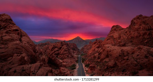 Valley Of Fire State Park, Nevada, United States. Aerial Panoramic View On The Scenic Road In The Desert During A Cloudy Twilight. Dramatic Sky Overlay.