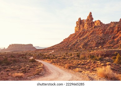 Valley of the Gods rock formation with Monument Valley at sunrise - Shutterstock ID 2229665285
