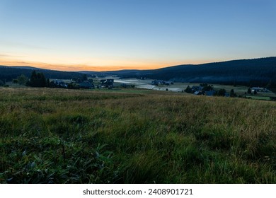 Valley of Jizerka in Jizera Mountains after sunset with a ground fog, mountain village - Powered by Shutterstock