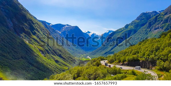 valley with road  in\
the summer in Norway