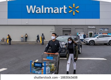 VALLEY STREAM, NY – DECEMBER 24: People exit the Walmart store on December 24, 2020 in Valley Stream, NY.