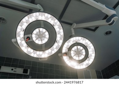 Valmiera, Latvia - March 20, 2024 - overhead surgical lights in an operating room, turned on and shining brightly, typically used to provide a clear view during medical procedures. - Powered by Shutterstock