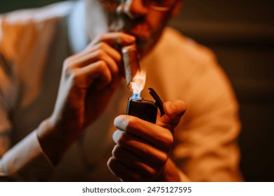 Valmiera, Latvia - September 9, 2023 -  Close-up of a person lighting a cigar with a lighter, showcasing a detailed and intimate moment of cigar smoking. - Powered by Shutterstock