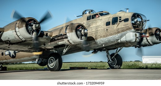 Valparaiso, Indiana/USA - 7-6-2016. B-17G WWII Flying Fortress Nine O Nine with spinning propellers on runway in Valparaiso, indiana