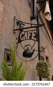 Val'quirico, Tlaxcala April 18 2022: Vintage Hanging Street Cafe Wall Sign With A Kettle Boiler Teapot