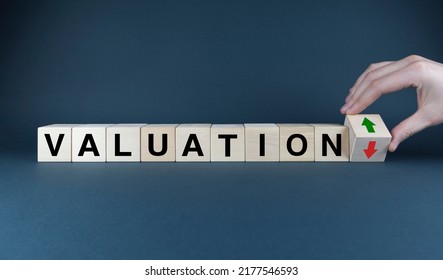 Valuation up or down. The cubes form the words Valuation up or down arrows. Valuation concept - Shutterstock ID 2177546593