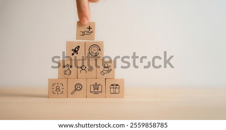Value added concept. Way to adding value to product and service. Wooden blocks with value added icons. Improving products, excellent service, expert advice, consistently upgrade, deliver fast.