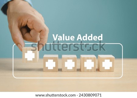 Value added increase benefit concept. Offer positive thing profit to benefit growth development business. Hand place wooden plus icon, add value more feature. Finance business investment strategy 