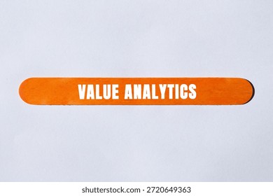 Value Analytics message written on wooden stick background. Conceptual Value Analytics symbol. Copy space.