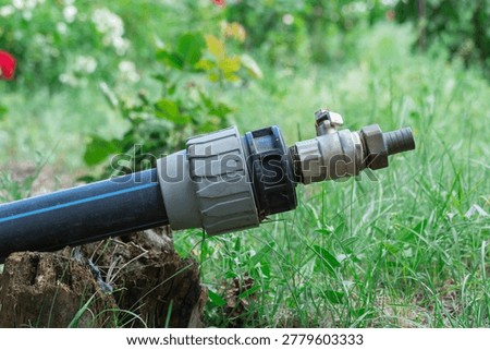 Valve and connecting pipes of old automatic watering of equipment pipeline. Turn off or turn on water switch. Regulator and control of water supply. Ball faucet on collector. Hoses plumb for sanitary.