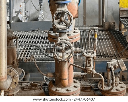 Valves and other safety equipment on an old steam boiler. Extensive wear, corrosion and contamination of the equipment and the boiler. ストックフォト © 