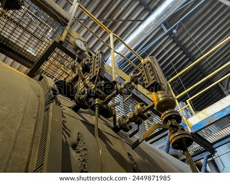 Valves and other safety equipment on an old steam boiler. Extensive wear, corrosion and contamination of the equipment and the boiler. ストックフォト © 