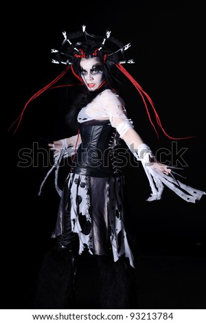 vampire woman with stage make-up, isolated on black