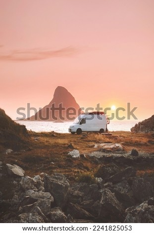 Van car camper at sunset ocean beach road trip in Norway caravan RV trailer travel on wheels vacations camping outdoor van life 