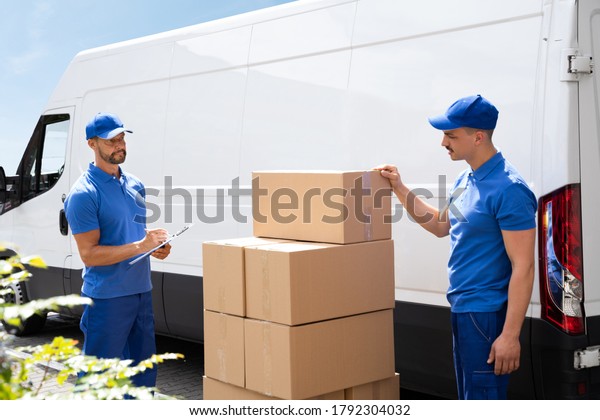 Van Courier\
And Professional Movers Unload\
Truck