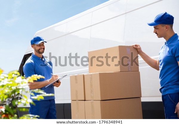 Van Courier\
And Professional Movers Unload\
Truck