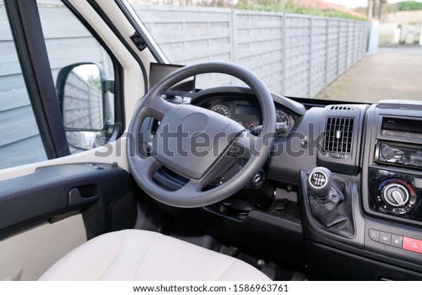 van\
driver white seat dashboard black gearbox\
handle