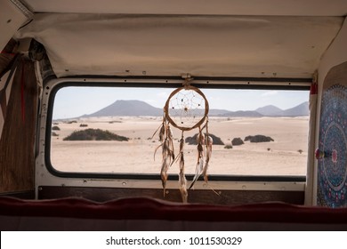 van life concept for different alternative life and way of travel. Dreamcatcher on the window with desert and mountains outdoor. mandale at the left, quiet situation - Powered by Shutterstock