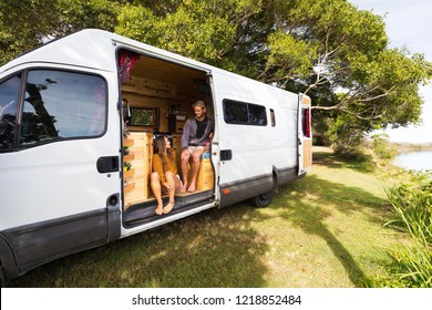 Van Life Couple In Bohemian Camper Van At A Scenic Australian Location