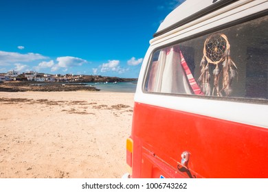 van life. dreamcatcher inside and old fisherman town outside with beautiful beach in fuerteventura. Summer concept for different vacation - Powered by Shutterstock