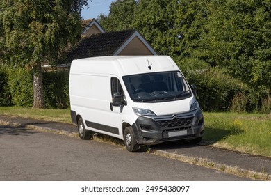 Van parked on a pavement obstructing it for pedestrians. Suffolk UK