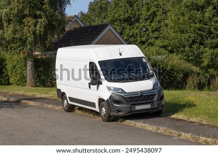 Van parked on a pavement obstructing it for pedestrians. Suffolk UK
