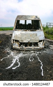 Van Stolen And Burnt Out, Left In Field Gateway. Interesting Patterns From The Melted Alloy When The Engine Components Melted