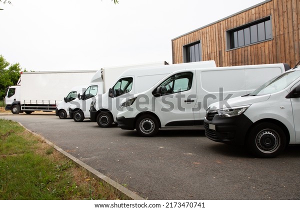 van transportation truck\
park white Delivery Trucks in Warehouse distribution logistic\
Building