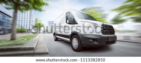 Van traveling in the city