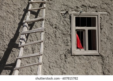 VAN, TURKEY - OCTOBER, 06, 2012: Adobe House Detail, Wooden Stairs And Red Curtain