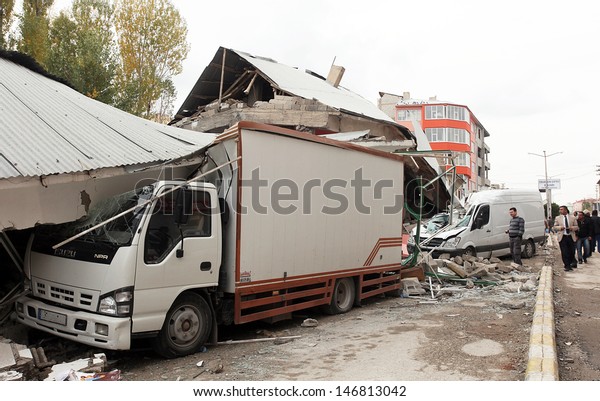 VAN,
TURKEY - OCTOBER 25: Buildings and truck ruined during the
earthquake of Van-Ercis on October 25, 2011 in Van, Turkey. It is
604 killed and 4152 injured in Van-Ercis
Earthquake.