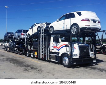 VANCE, AL-MAY, 2015:  Mercedes Benz vehicles being loaded on a transport truck (automotive car carrier) at the factory for delivery to a dealership.  