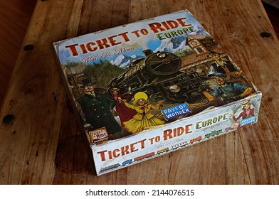 Vancouver, BC, Canada- 04 08 2022: The Box For The Board Game Ticket To Ride, Laying On A Wooden Table.