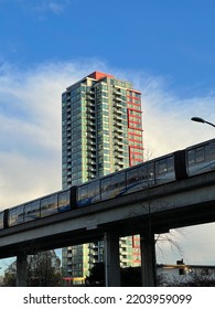 Vancouver, BC, Canada: 11 April 2022 - Modern Building And Sky Train Around  Metrotown