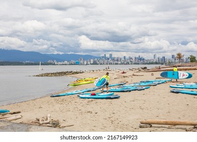 Vancouver, BC, Canada, 6 13 2022: The Scenic View To Jericho Beach, Some People In The Uniform Are Carrying The Sup Boards On A Overcast Day