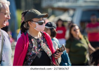 Vancouver, BC, Canada, 7 01 2022, A Woman In A Mask In The Crowd During The Canada Day Celebrations In Downtown