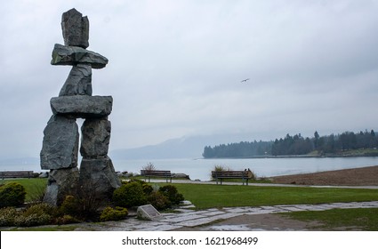 Vancouver, BC ,Canada, December 30th, 2019: Inukshuk, an outdoor inuksuk by Alvin Kanak, installed at Vancouver's English Bay