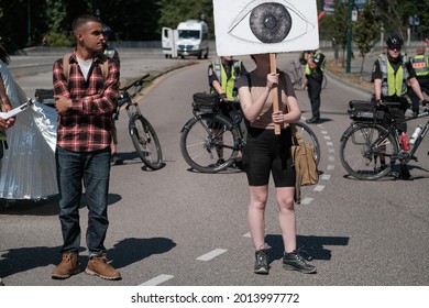 Vancouver, BC, Canada - July 24, 2021:  Activists block access to the Burrard Street Bridge at an "Extinction Rebellion" climate change protest