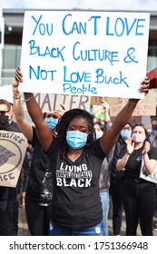 Vancouver, BC, Canada - Jun 05 2020: Portrait of a black girl with dreadlocks at the protest holding a sign "...love black culture..."
