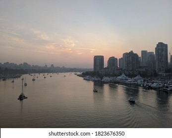 Vancouver, BC / Canada - September 11 2020: Smokey Skies Over Vancouver BC From Wildfires In Washington. Photograph Taken At Sunset Shows The Cityscape From Cambie Street Bridge And False Creek. 