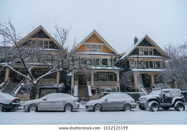 Vancouver BC Canada,February 2019.Vancouver\
city house and cars with snow\
backgrounds