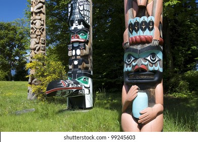 VANCOUVER, B.C. - MAY 22: Totem Poles in Stanley Park, the recurring symbols of the area indigenous population, are popular Vancouver's attraction. May 22, 2007 in Vancouver, British Columbia.